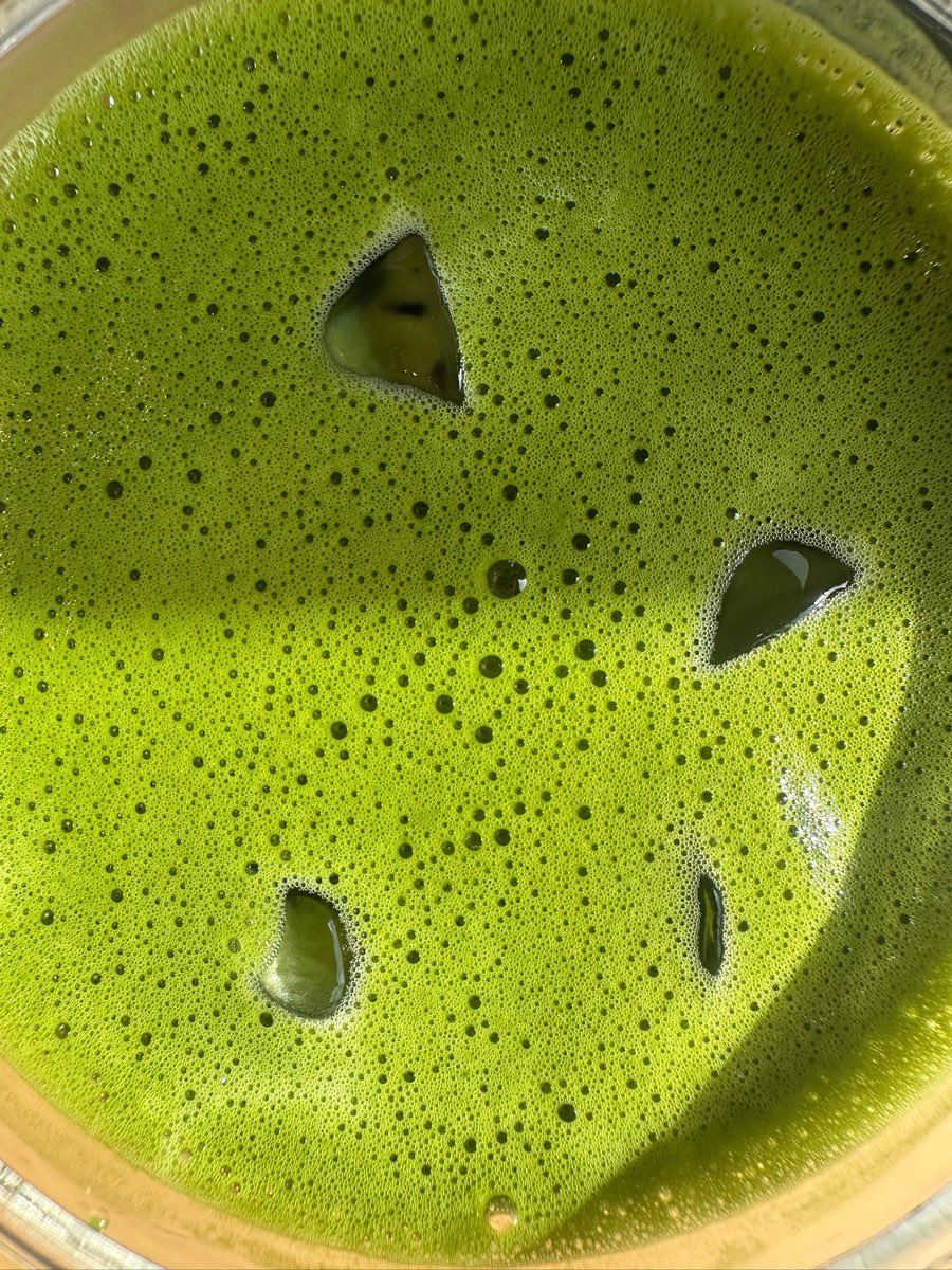 Close-up of whisked matcha with a fine, even foam